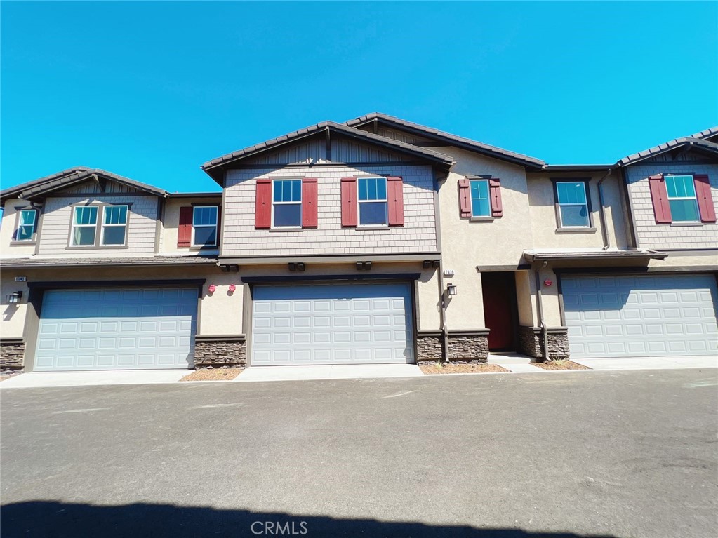 a front view of a house with a garage