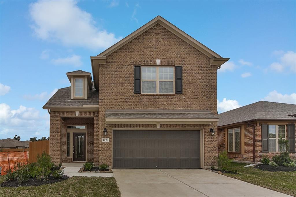 a front view of a house with garage