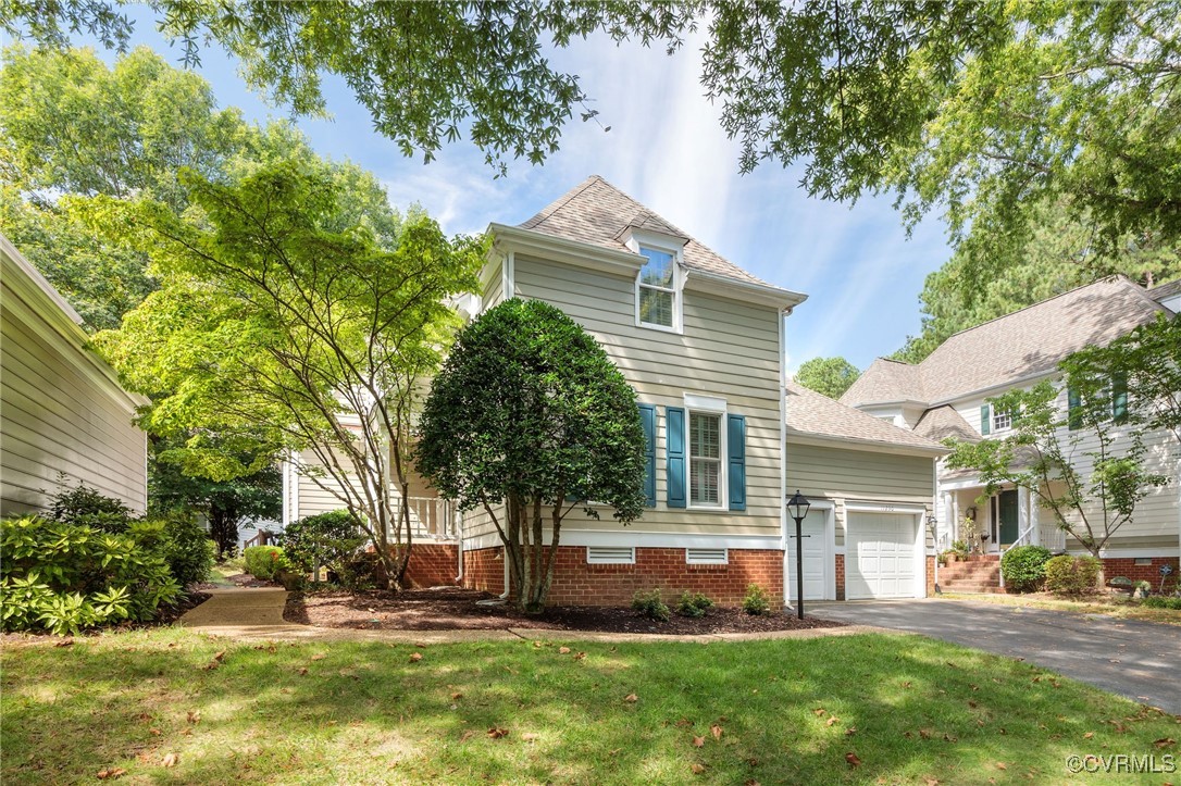 a front view of a house with a yard and outdoor seating