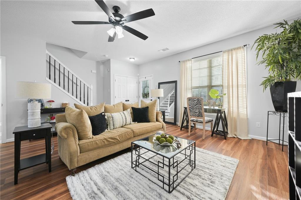 a living room with furniture and a large window