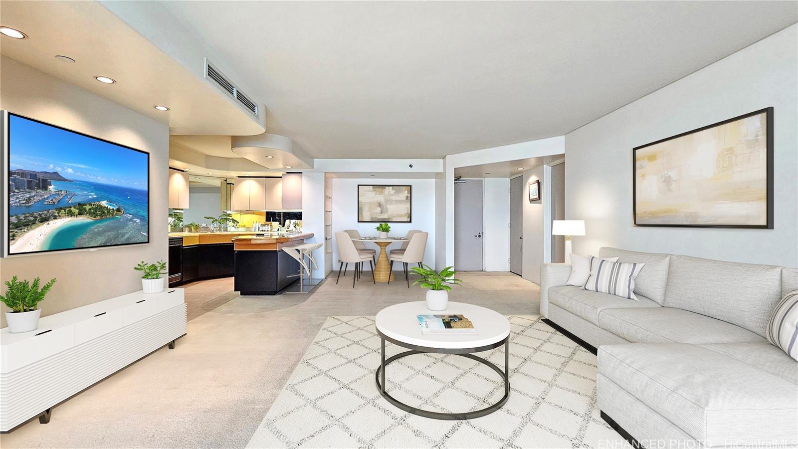 a living room with furniture and a view of kitchen