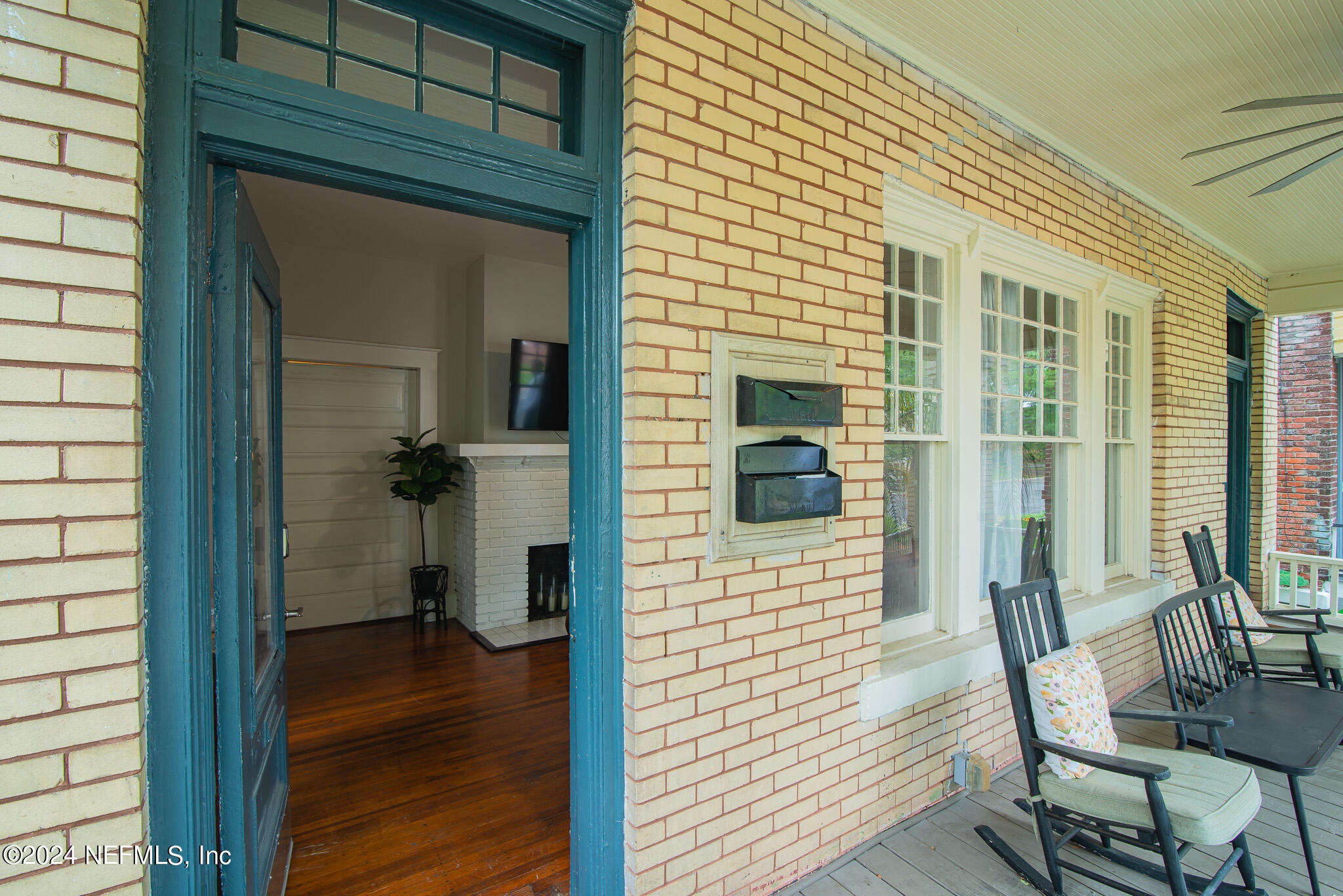 a view of a door and chair in the balcony