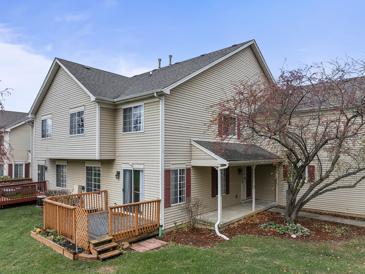 a front view of a house with a yard and porch