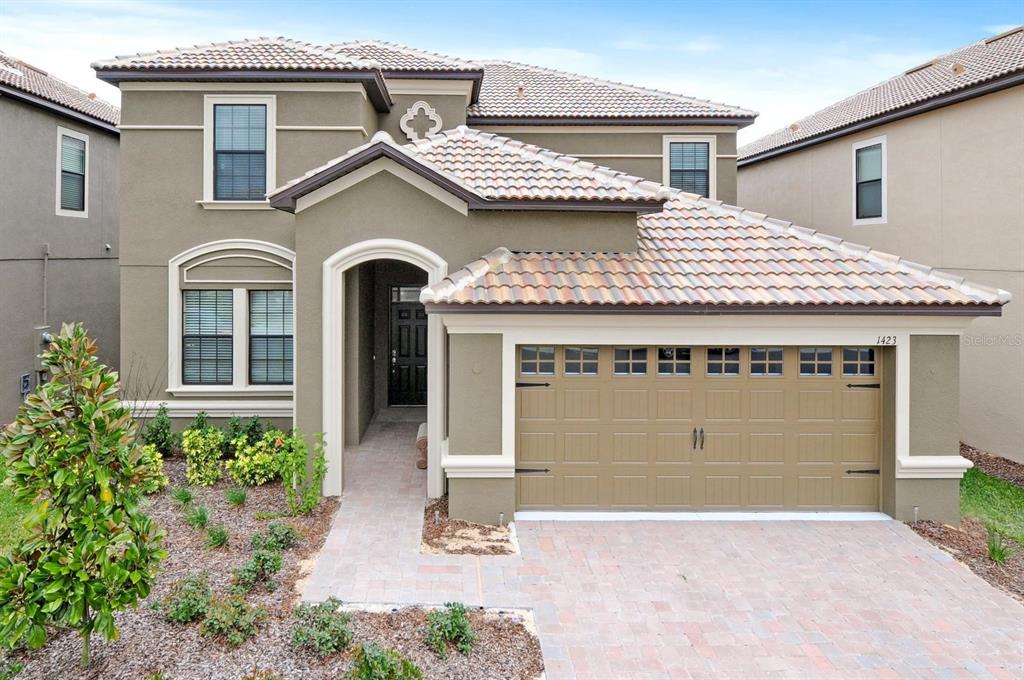 a view of a house with a garage and windows