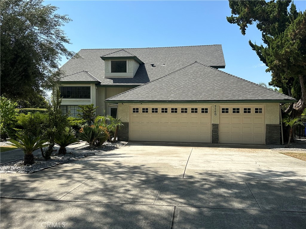 a house with trees in front of it