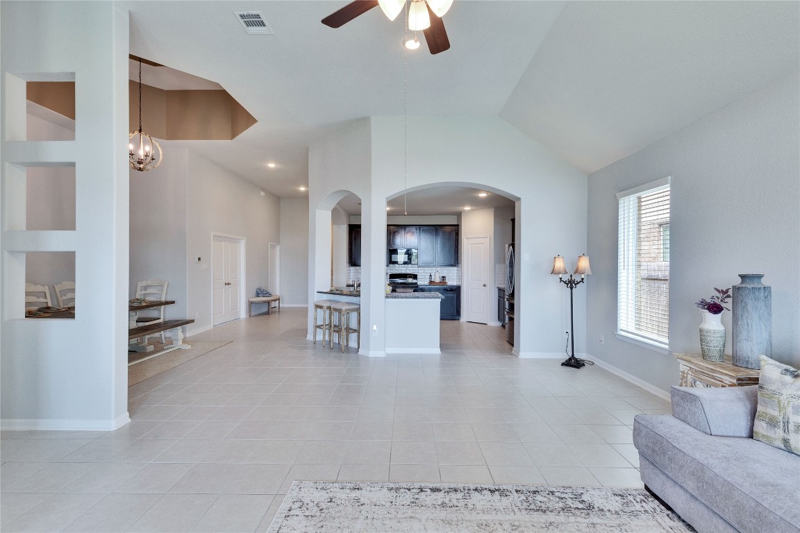 a view of kitchen with furniture and refrigerator