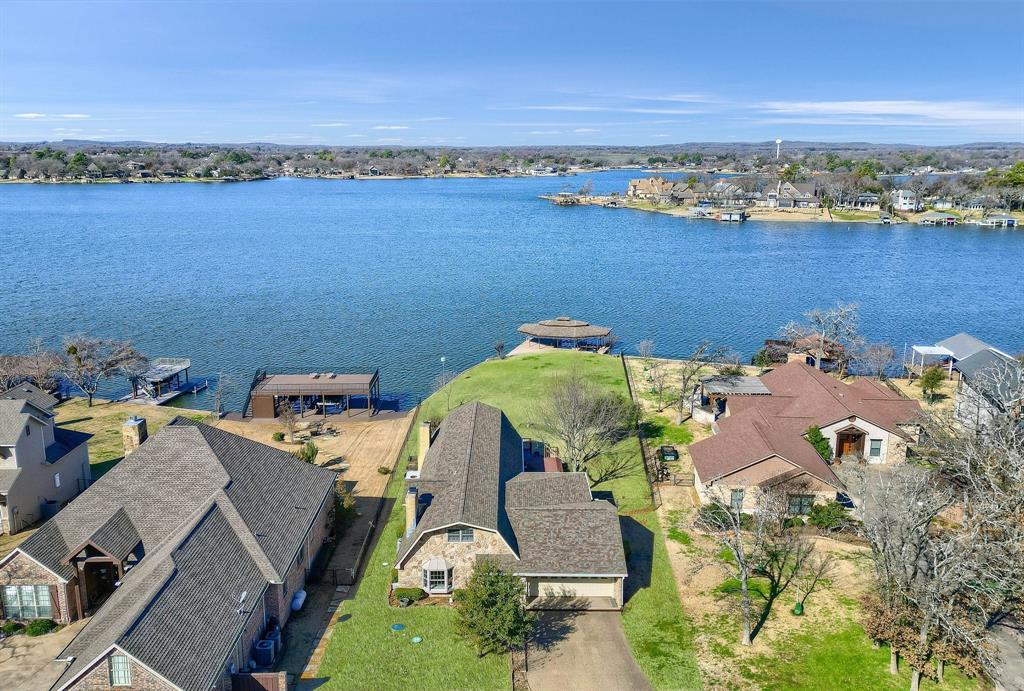 an aerial view of a house with a ocean view