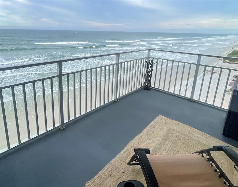 a balcony with an ocean view