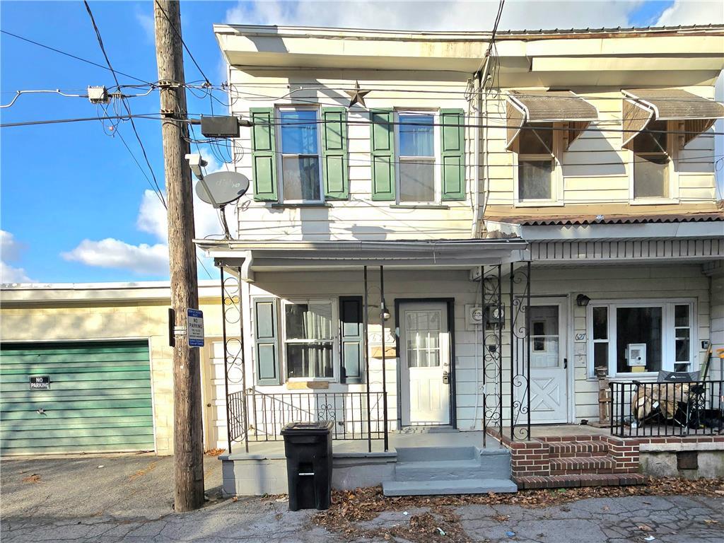 a front view of a house with a porch