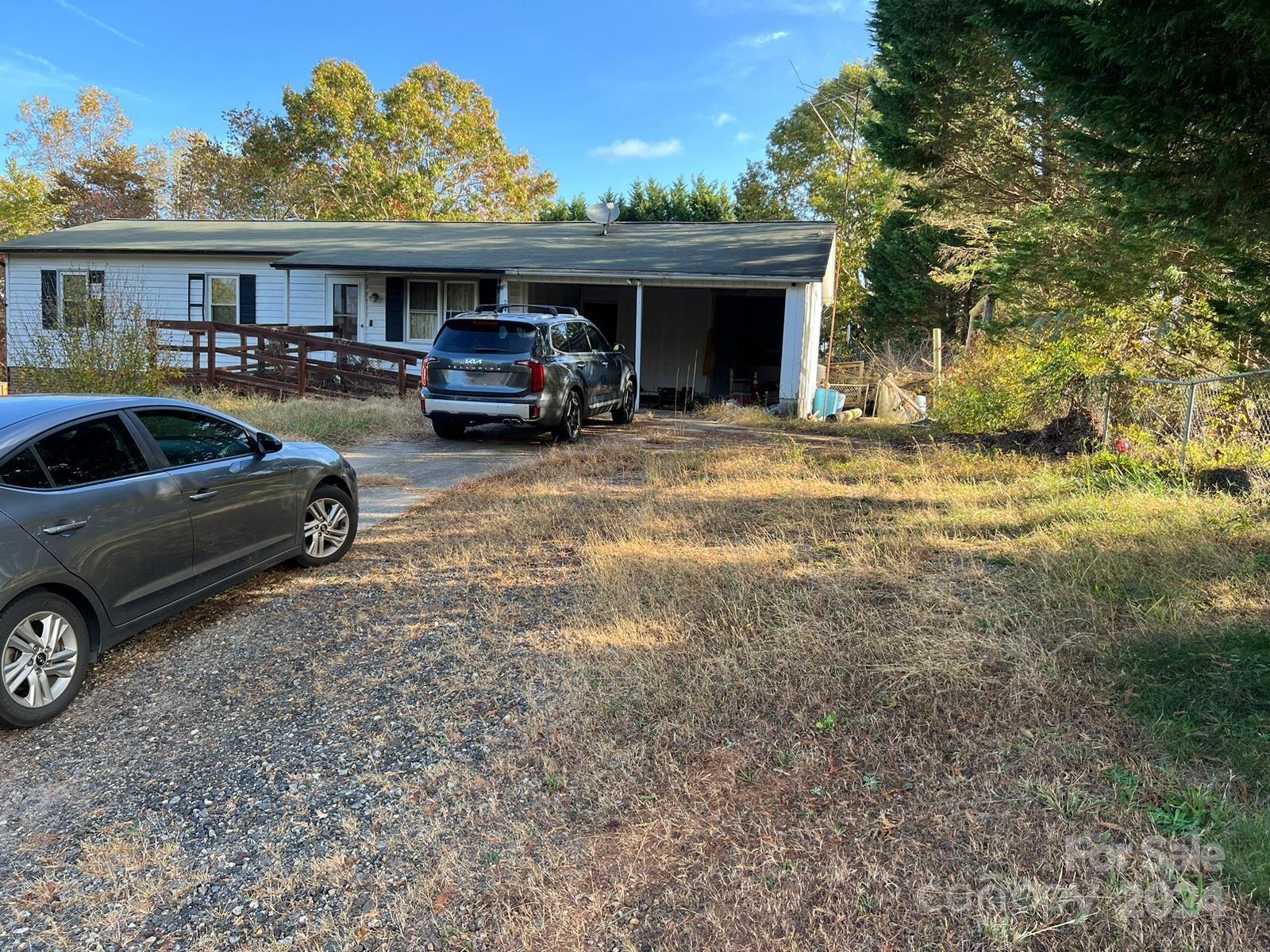 a view of a car park in front of house