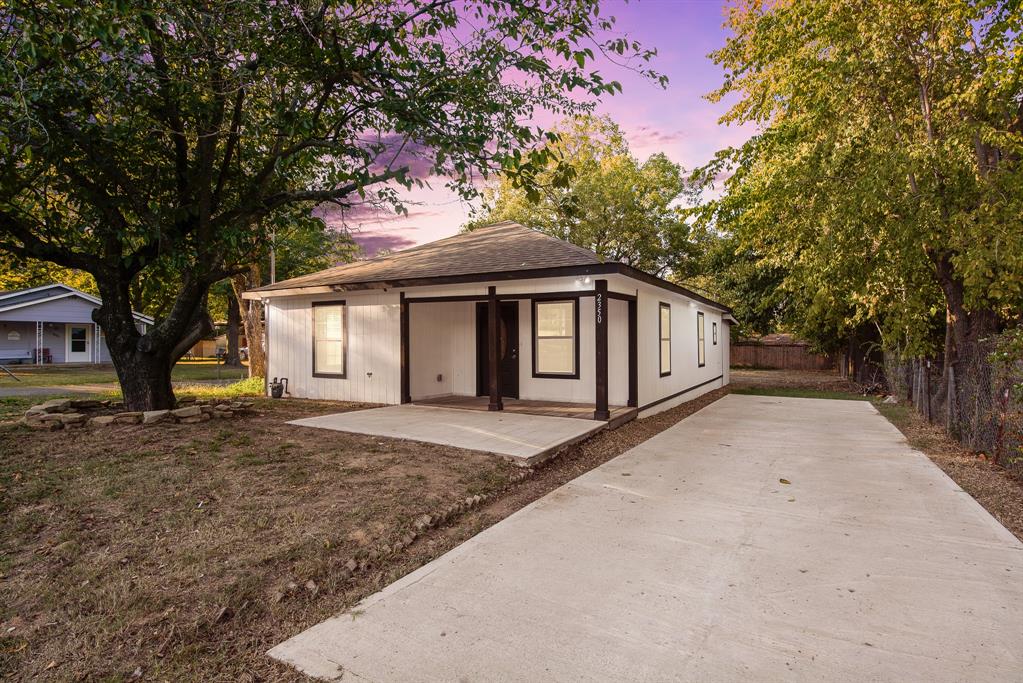 a house with trees in front of it