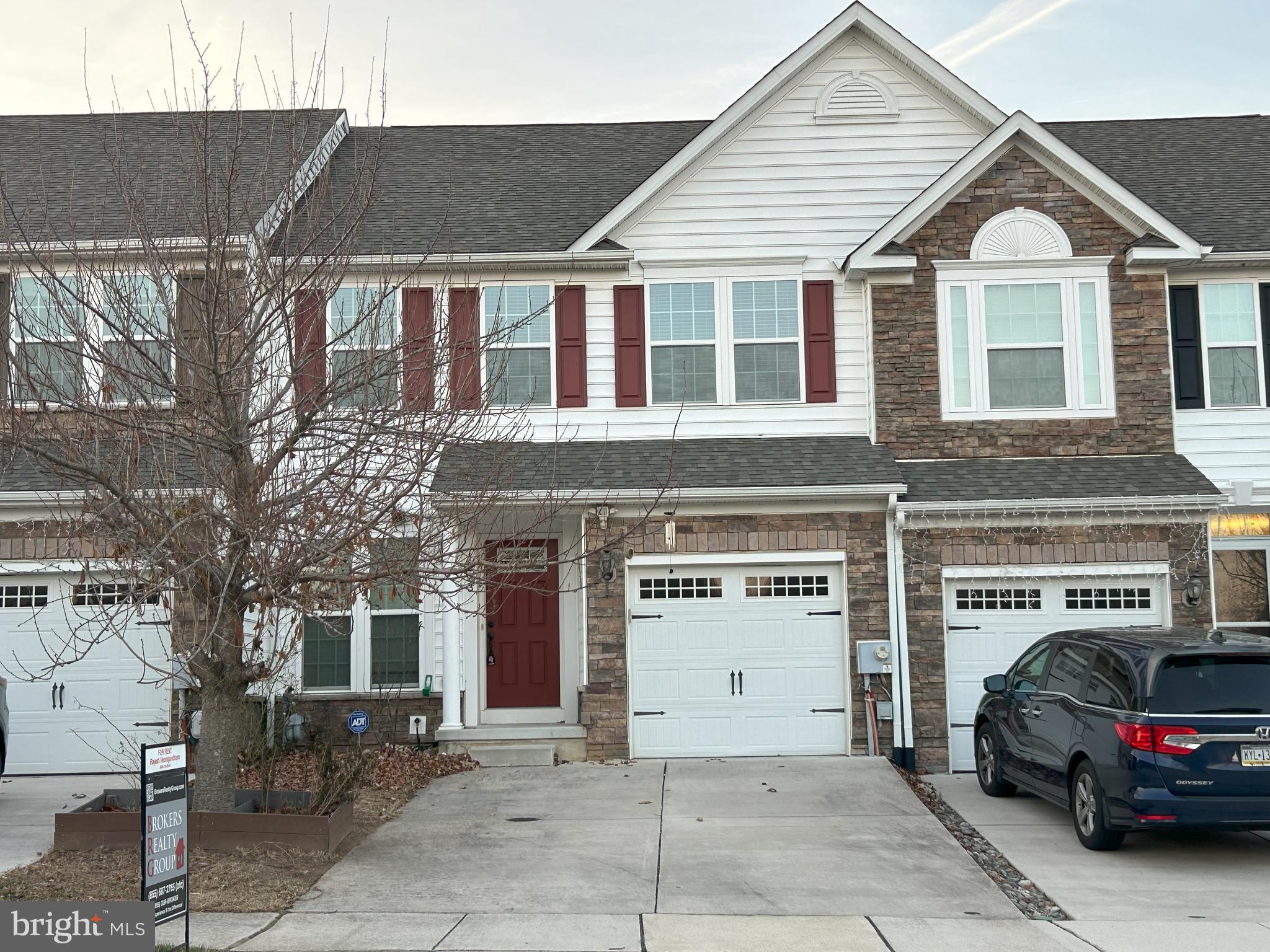 a view of a car park in front of house