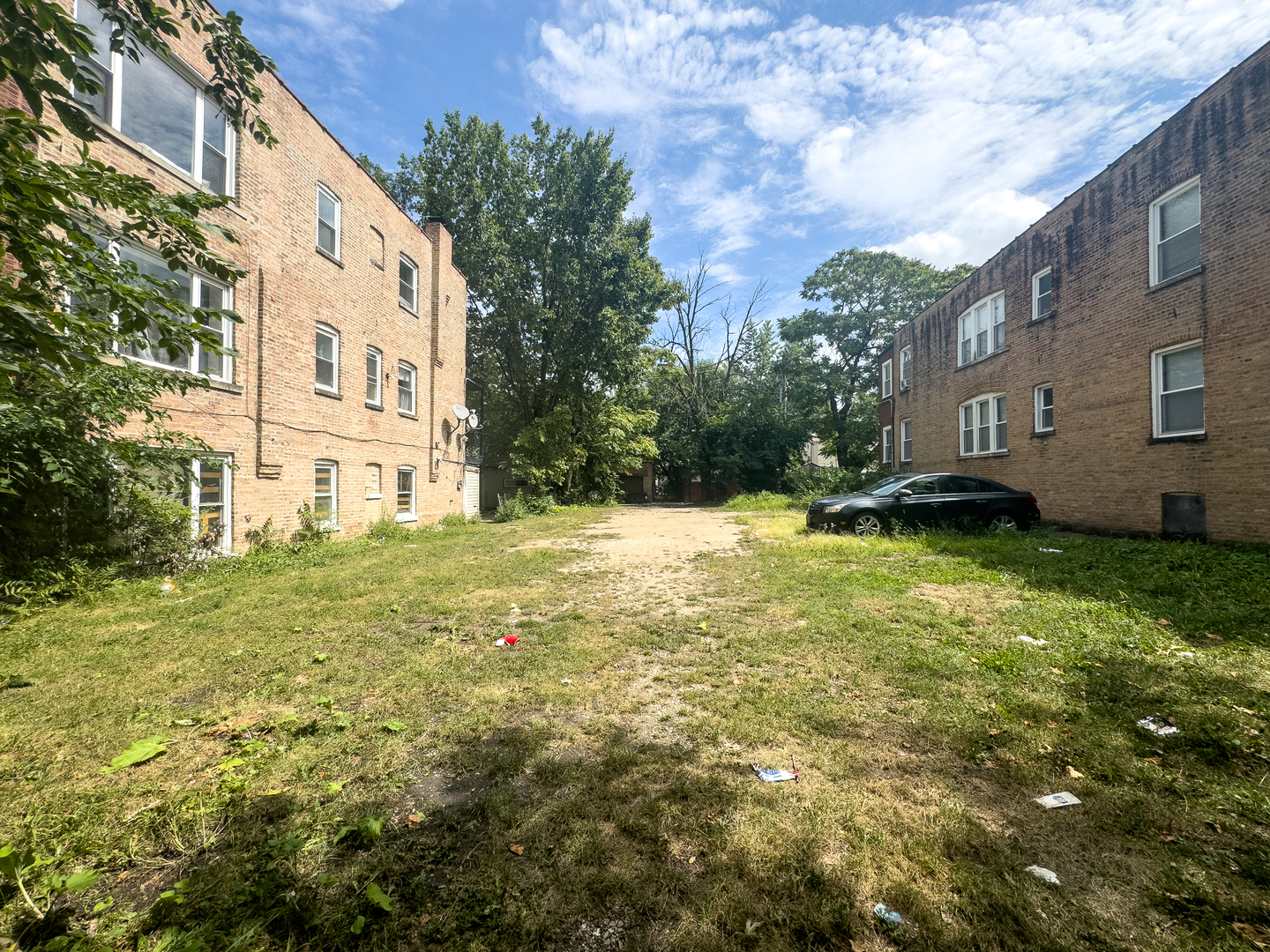 a view of a white house with a yard