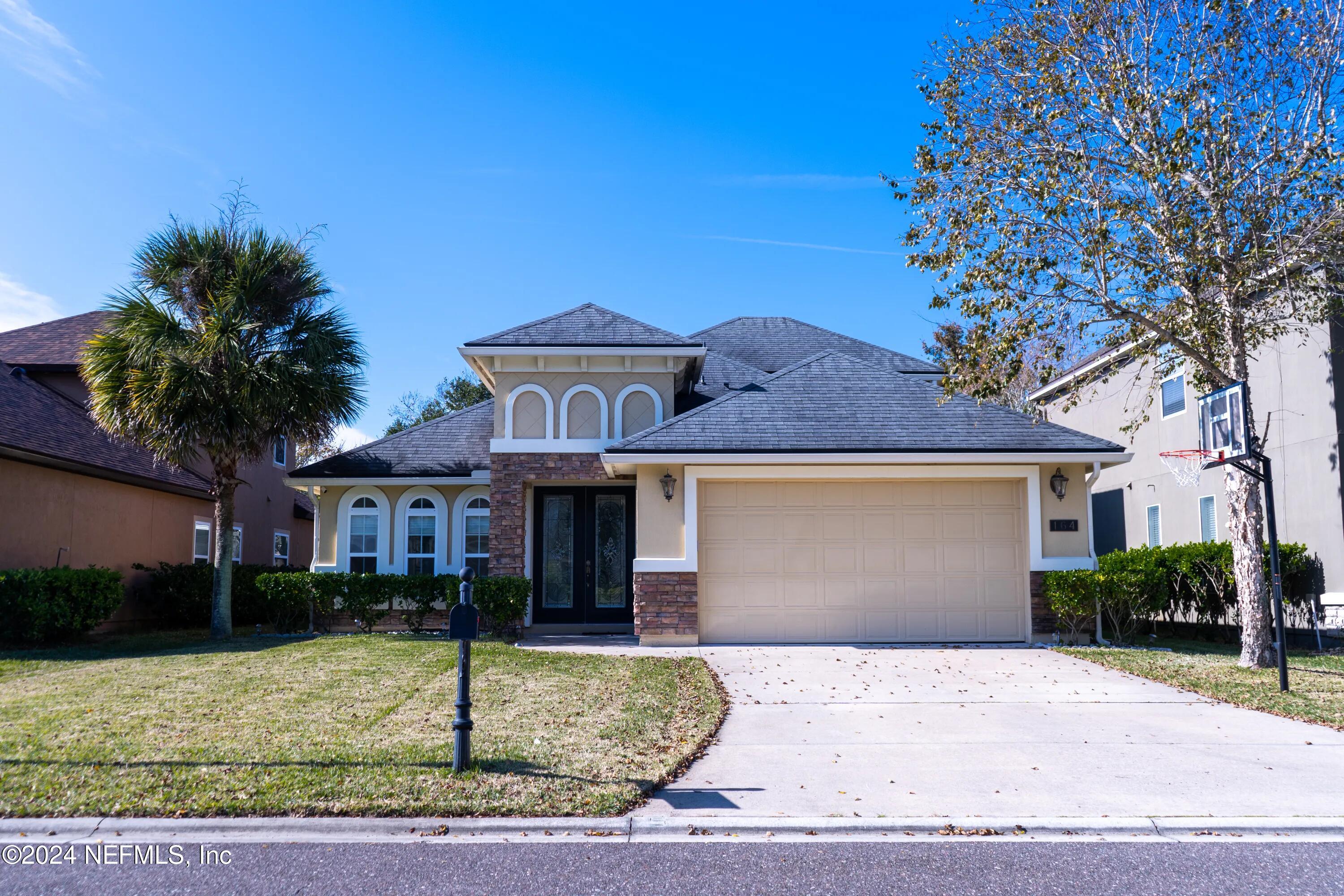 a front view of a house with garden