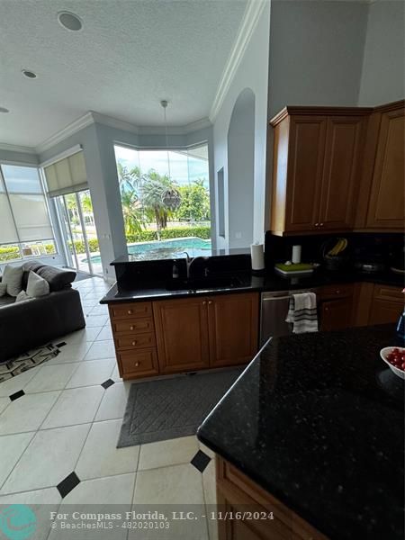 a kitchen with a large window in it and kitchen countertops