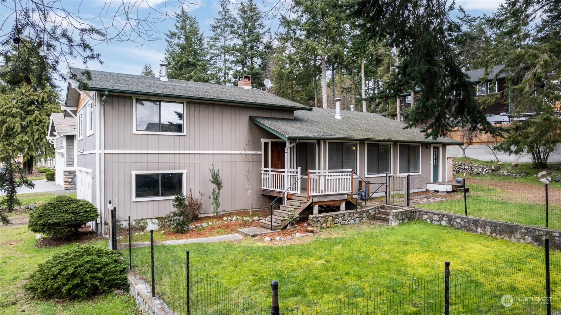 a front view of house with yard and outdoor seating