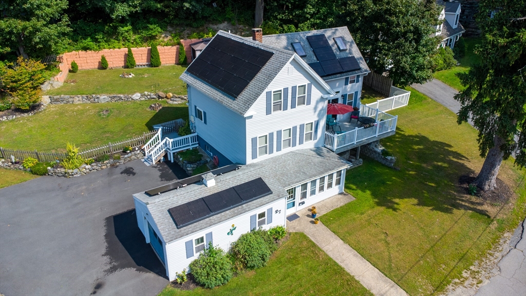 an aerial view of a house with a garden