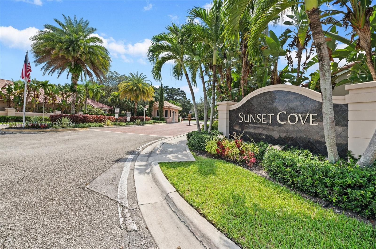 a view of outdoor space with sign board and palm trees