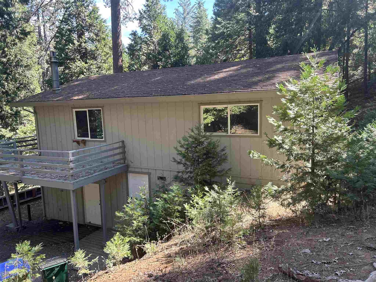 View of property exterior featuring a deck