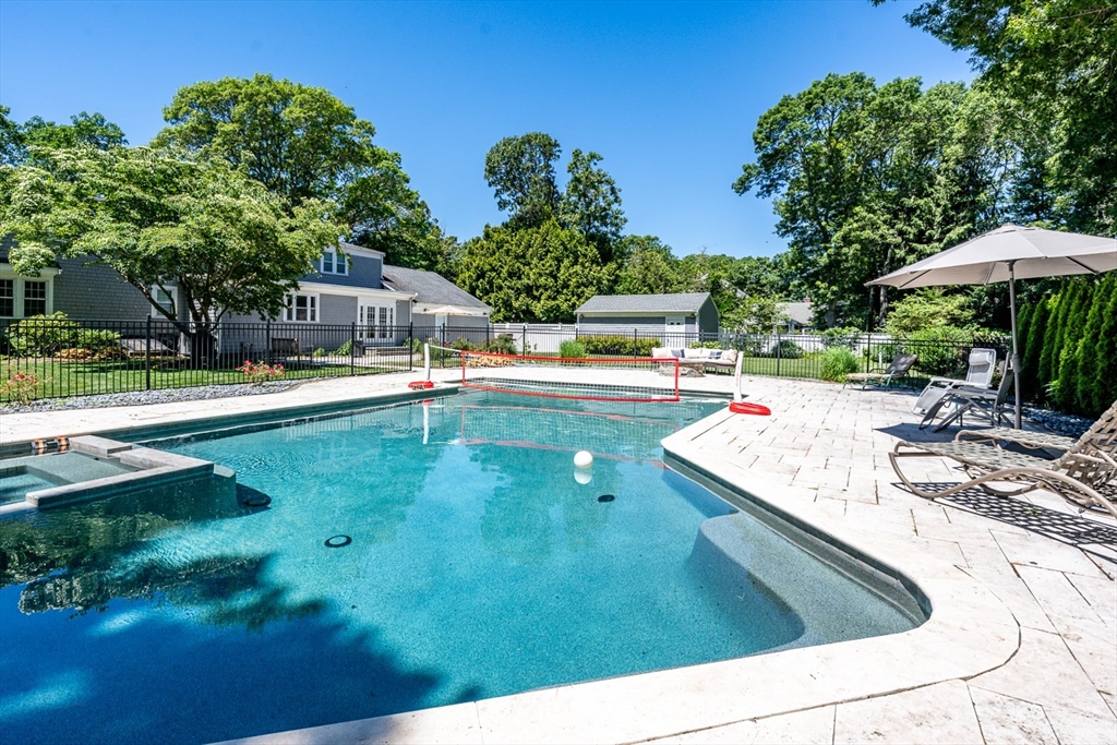 a view of a swimming pool with a patio