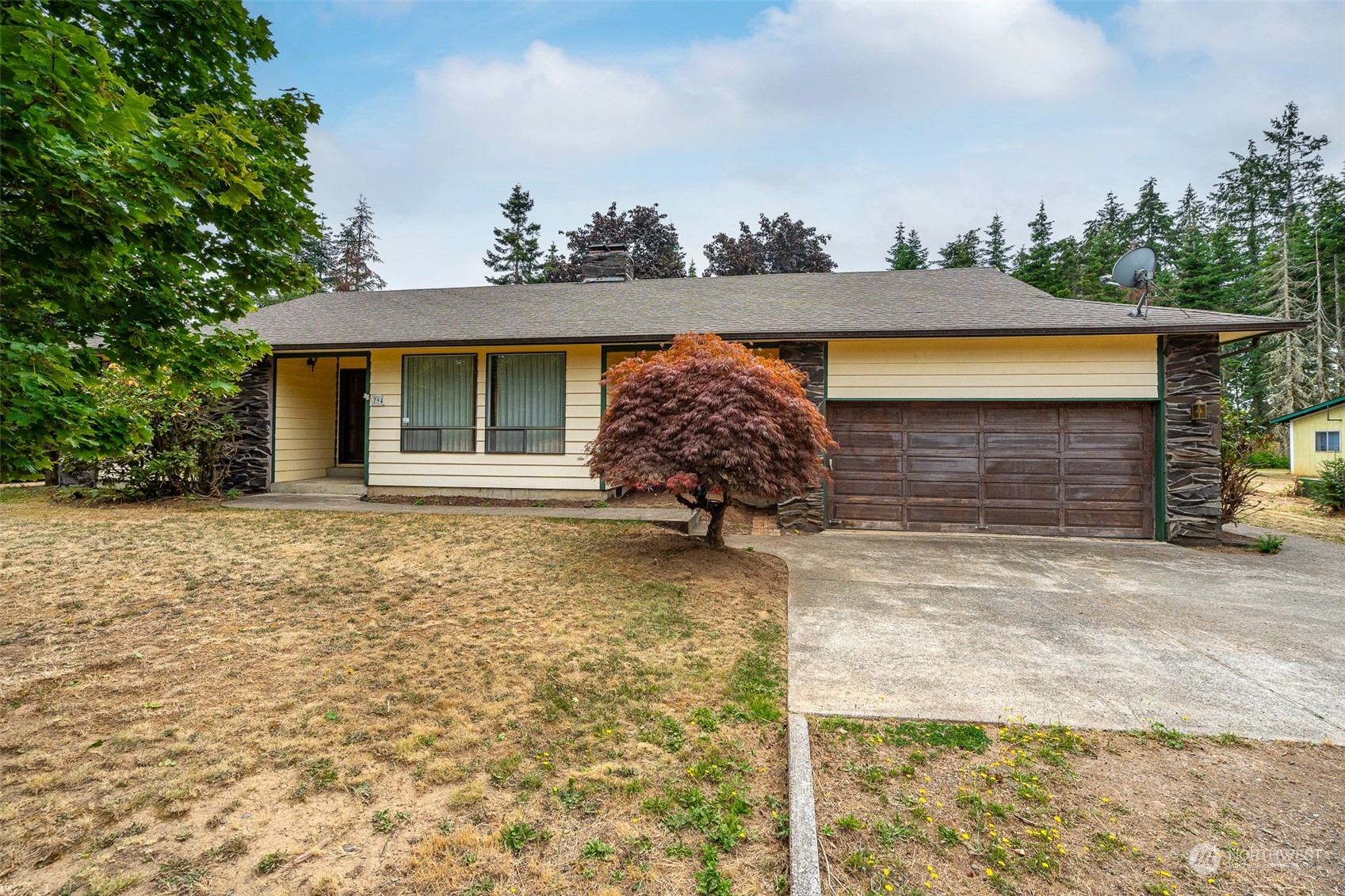 a front view of a house with a yard