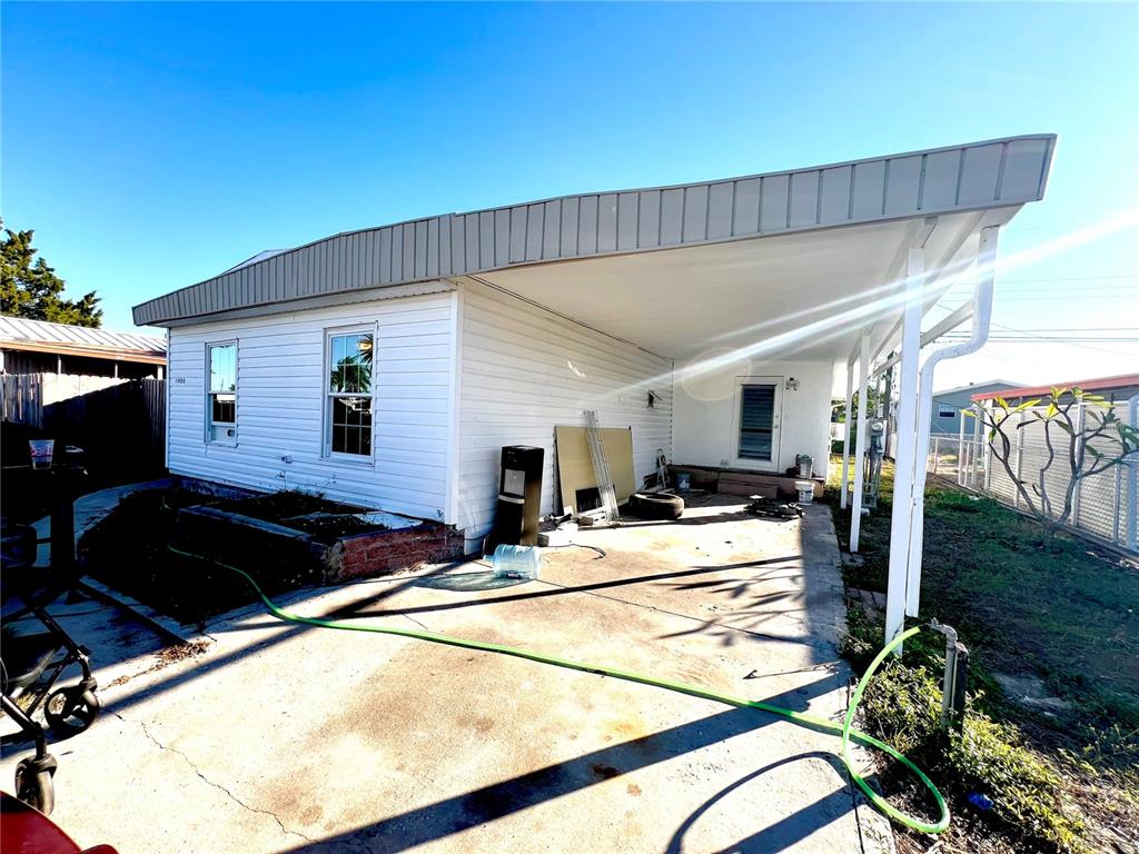 FRONT WITH CARPORT