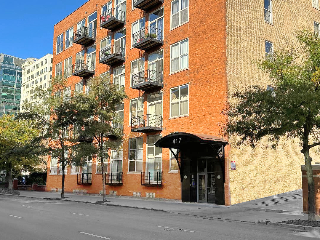 a view of a building with a street