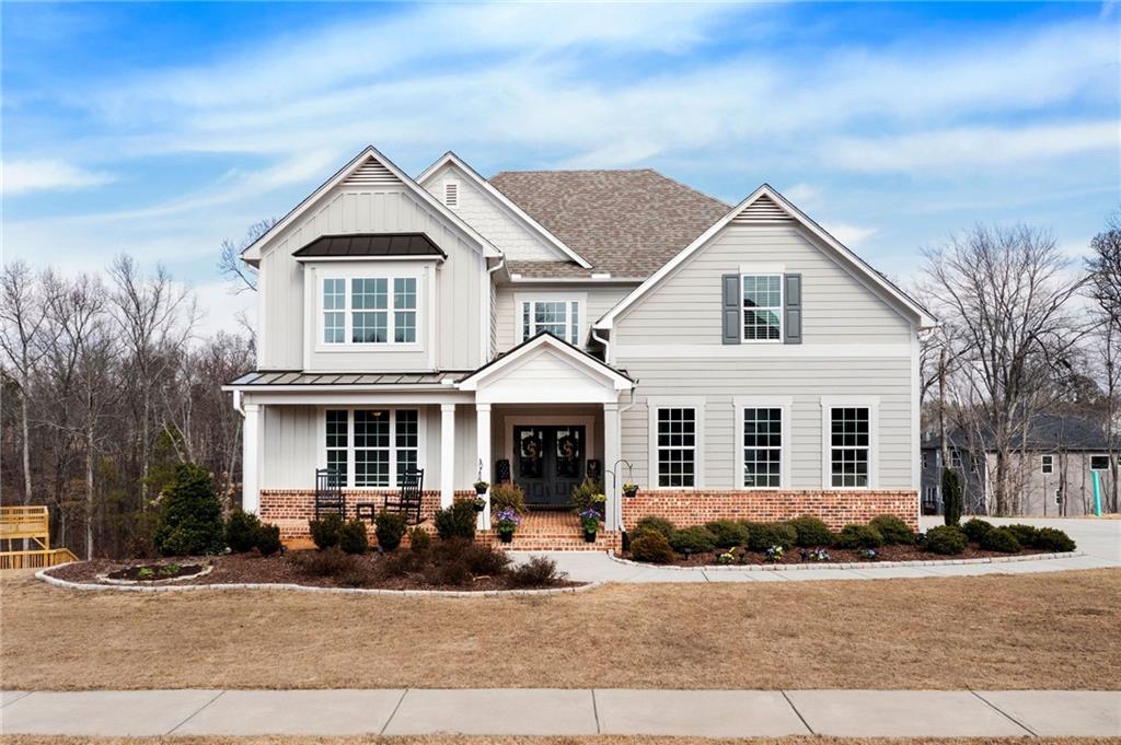 front view of a house with a yard