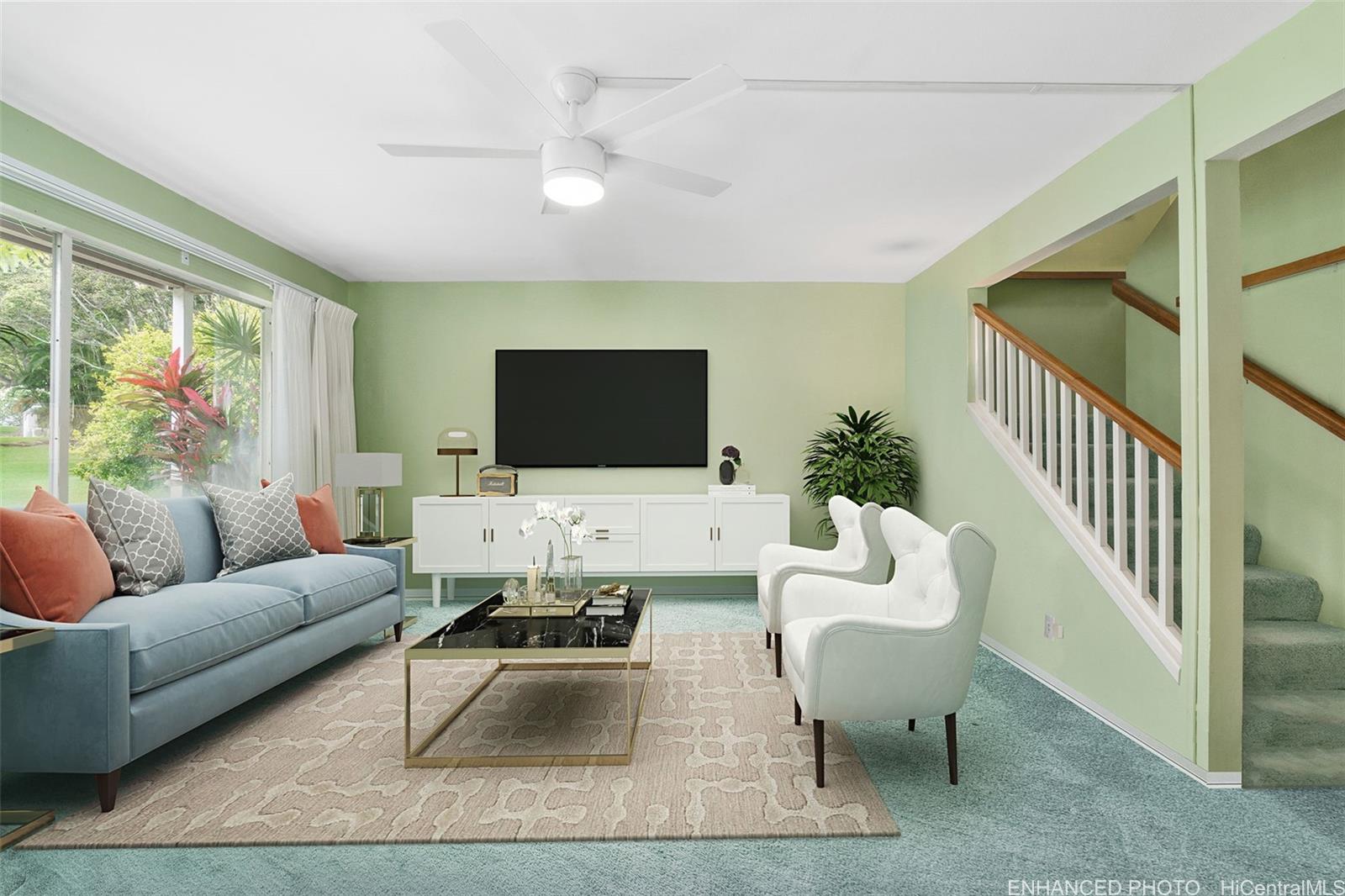 a living room with furniture and a flat screen tv