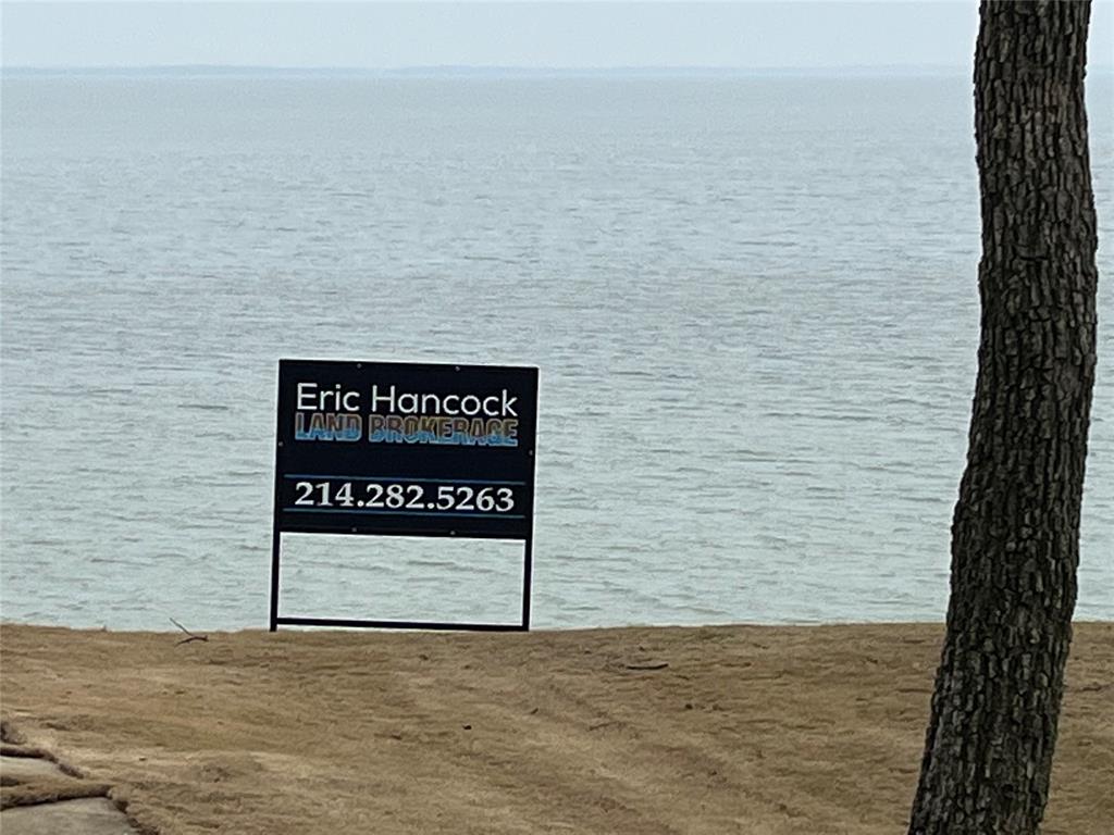 a sign board with an ocean view