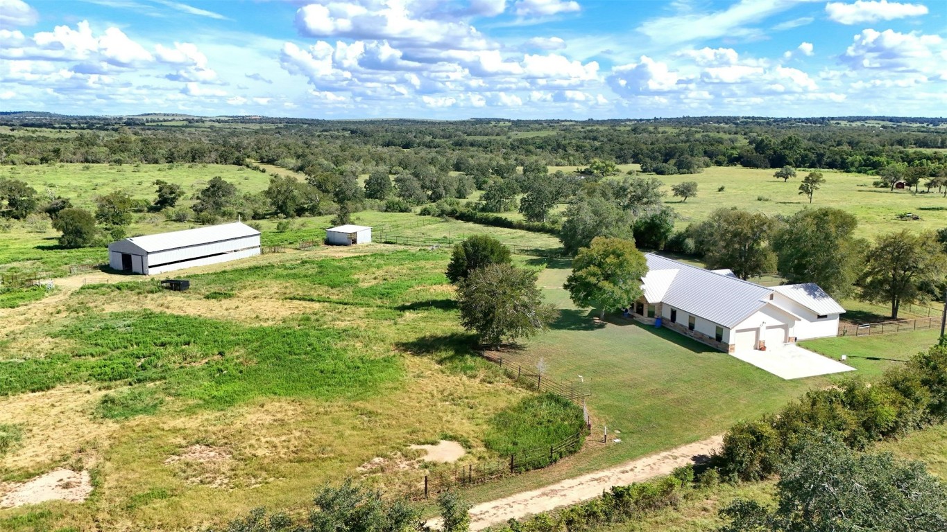 Beautiful country home on 21.5 acres with 2 barns, pond and pastures