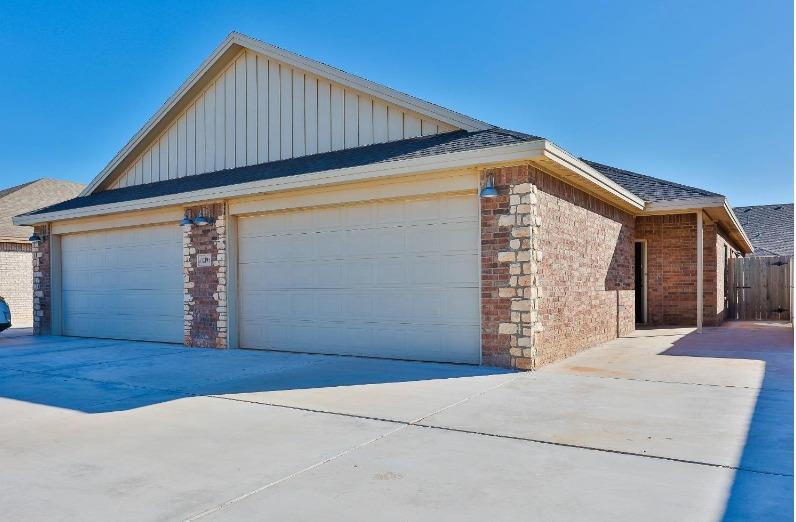 a front view of a house with a garage