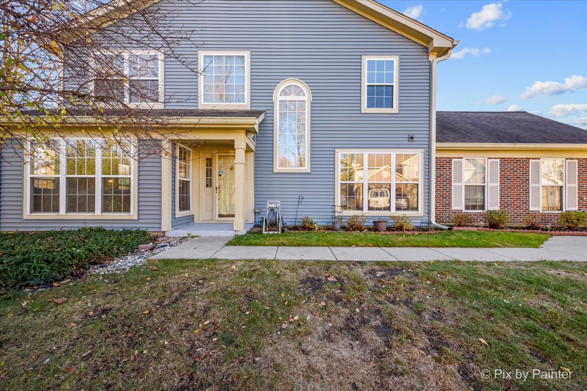 a front view of a house with a yard