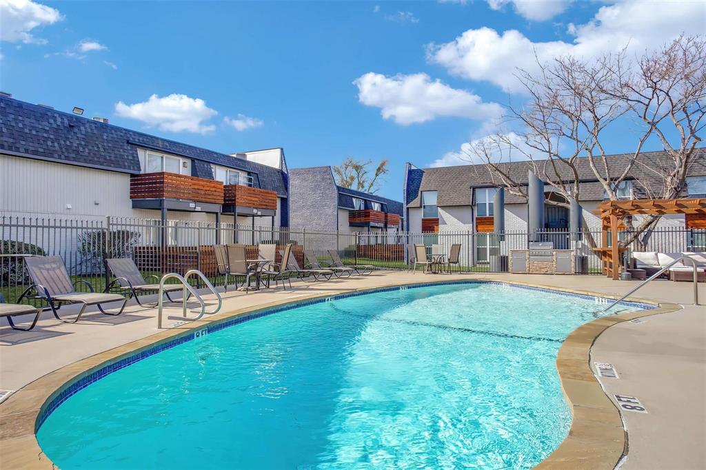 a swimming pool with outdoor seating and yard