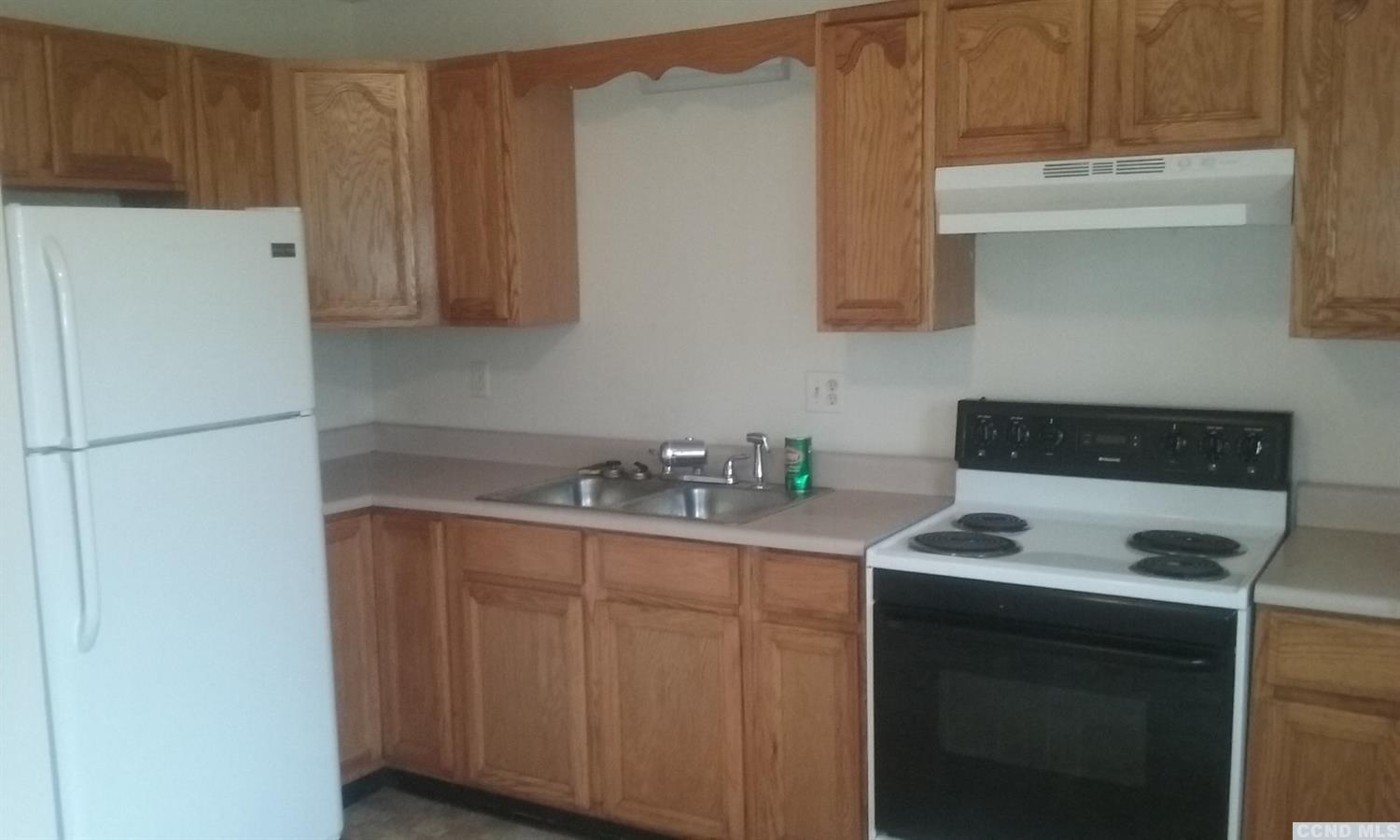 a kitchen with stainless steel appliances granite countertop a refrigerator stove a sink and dishwasher