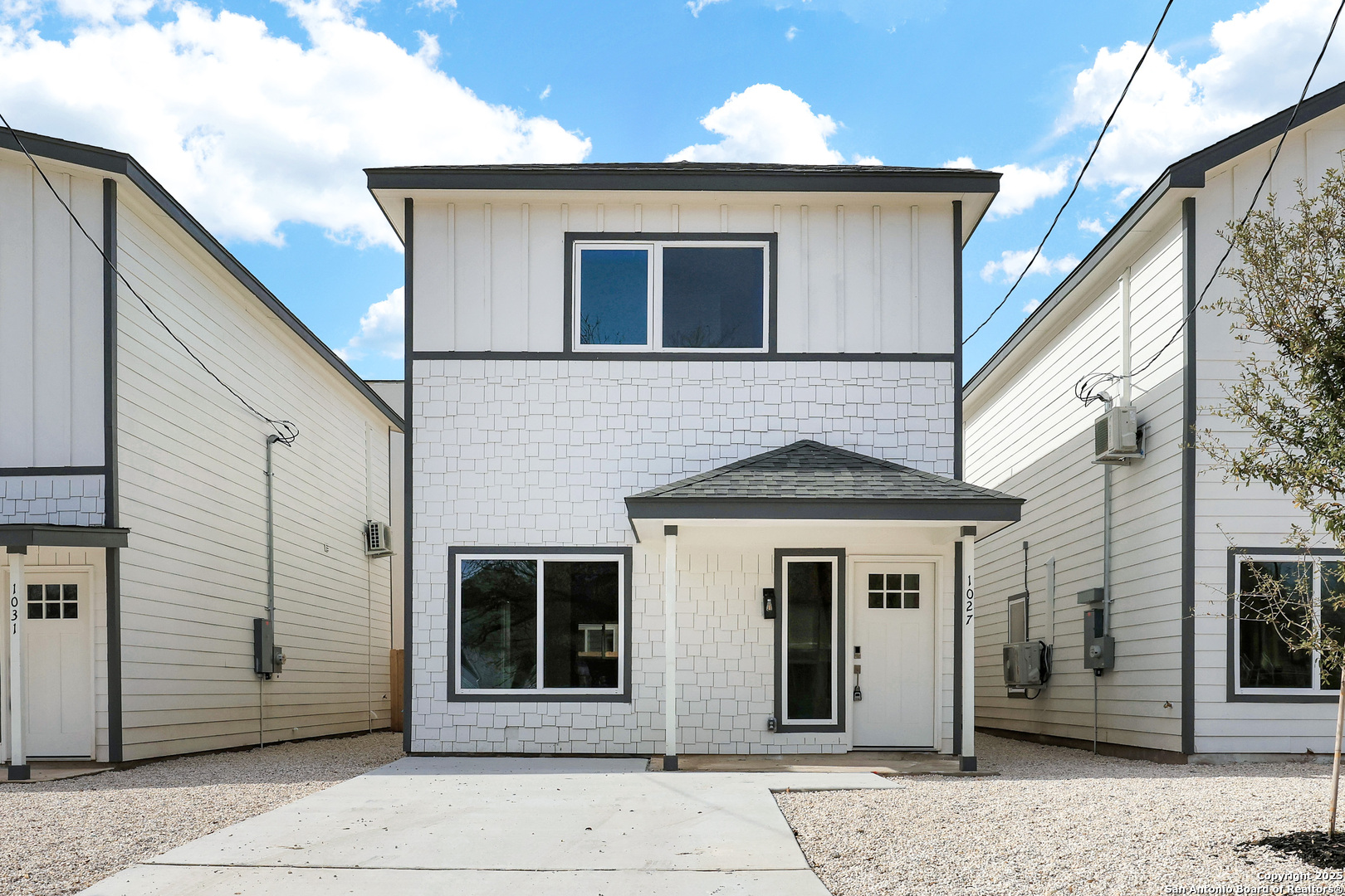 a front view of a house with a garage