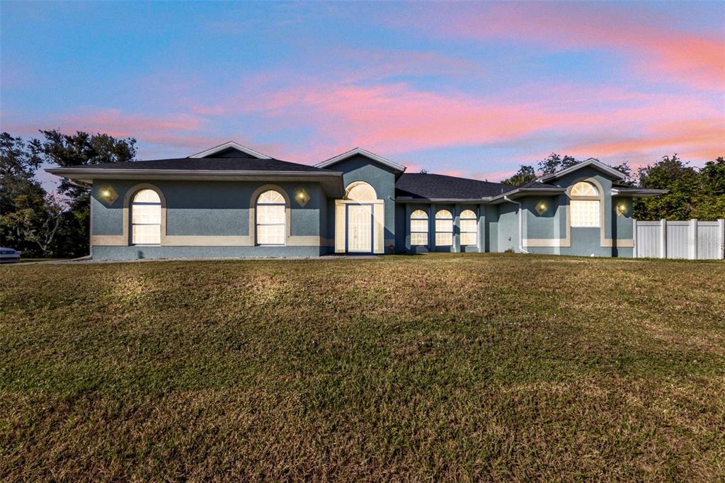 a front view of a house with a yard