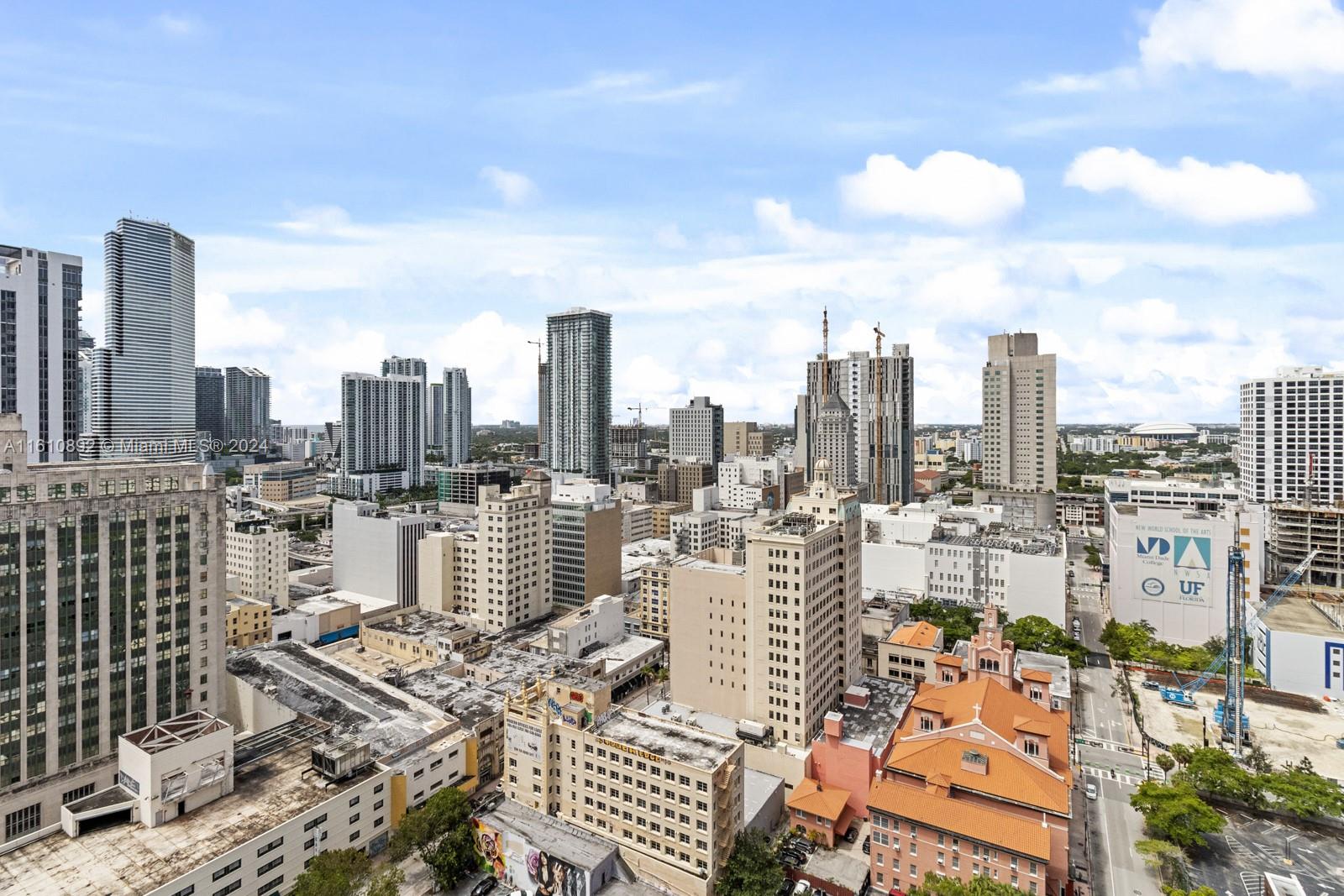 a view of a city with tall buildings