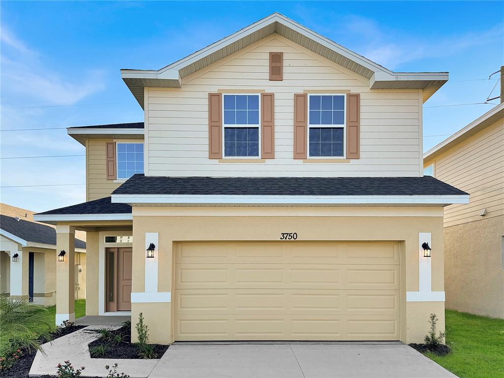 a front view of a house with garage