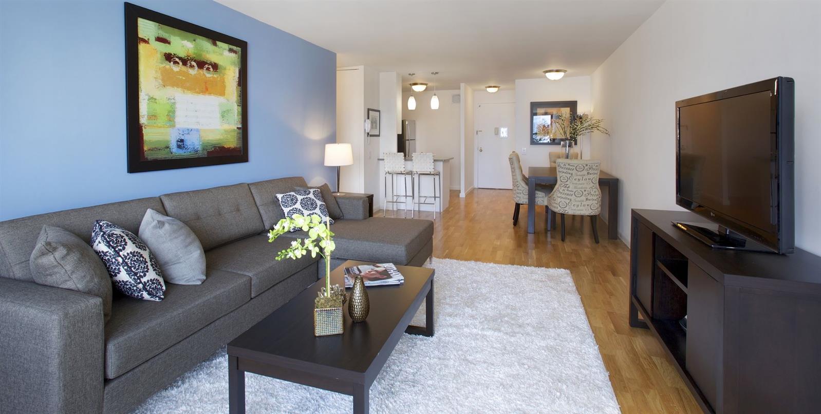 a living room with furniture and a flat screen tv