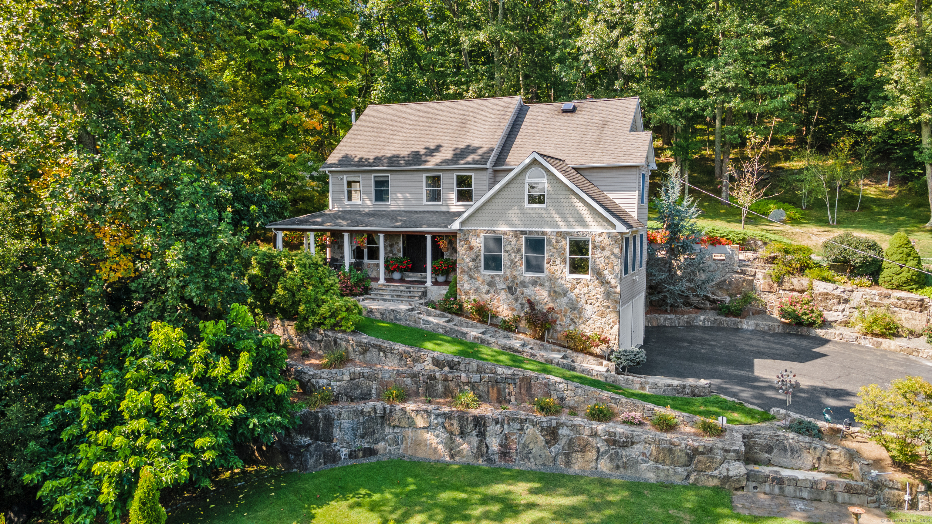 a aerial view of a house with a yard