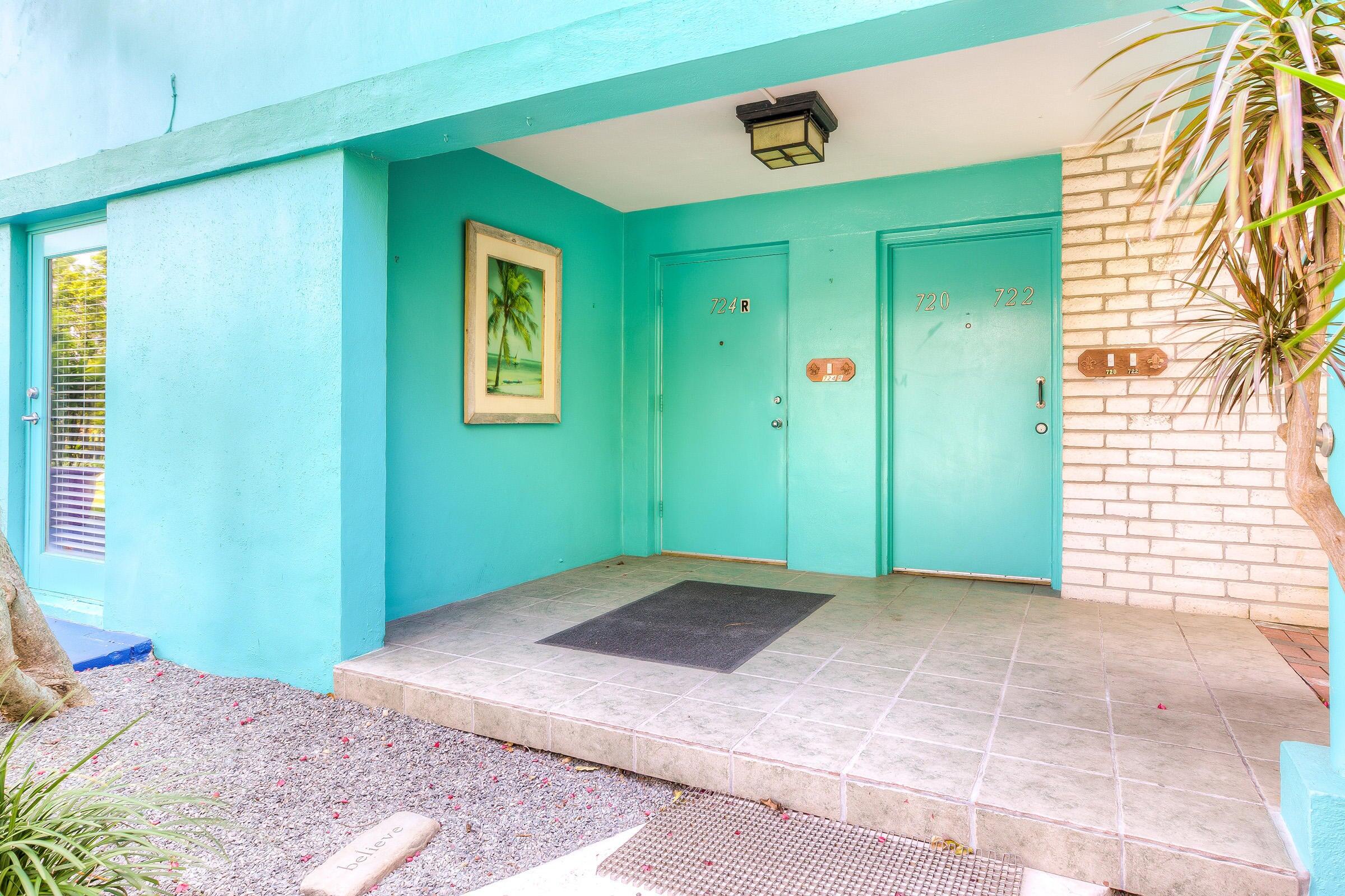 a view of backyard with entryway and windows