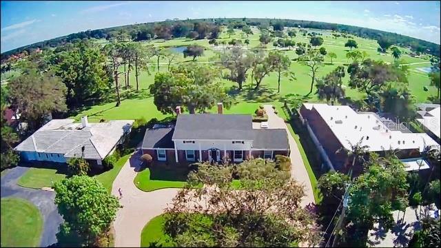 an aerial view of a house with garden