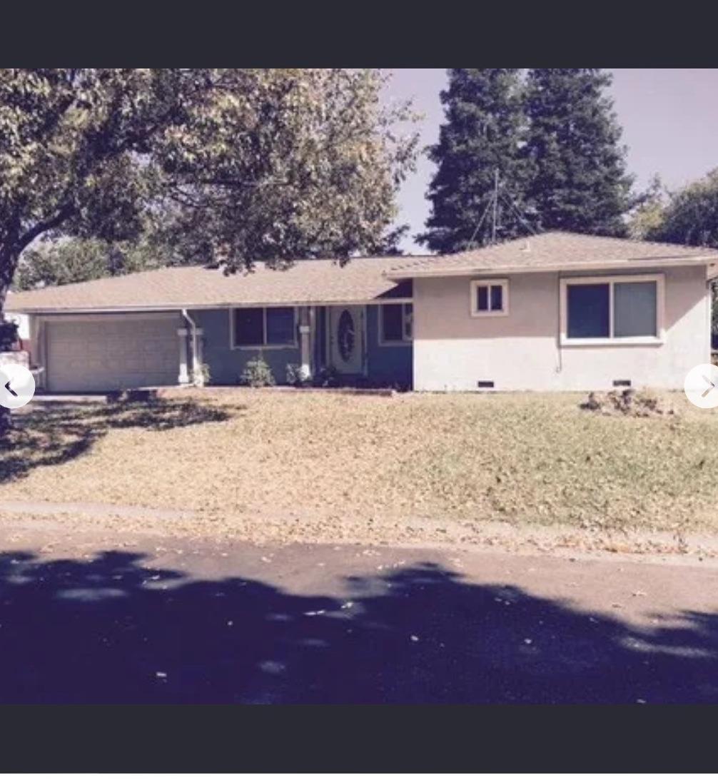 a front view of a house with yard