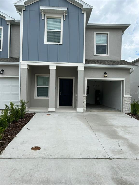 a front view of a house with yard