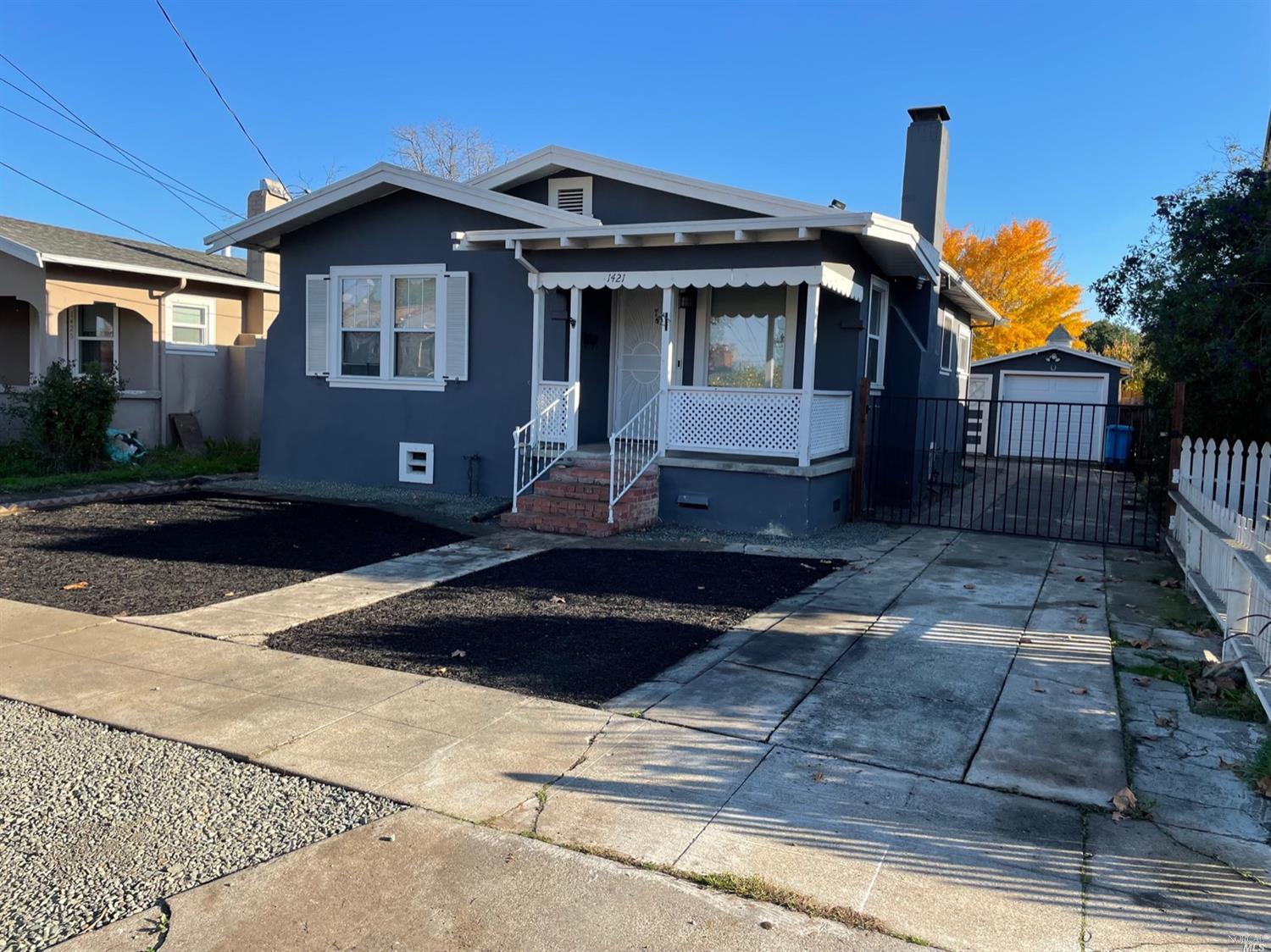 a front view of a house with yard