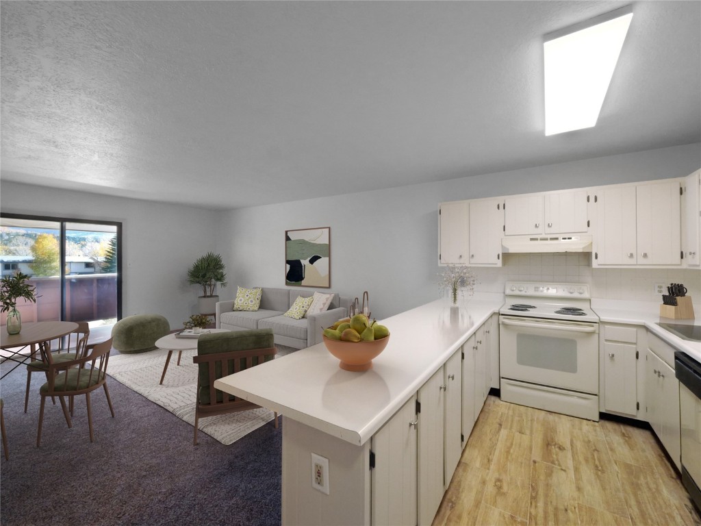 Kitchen with kitchen peninsula, tasteful backsplash, white cabinetry, light wood-type flooring, and white electric stove