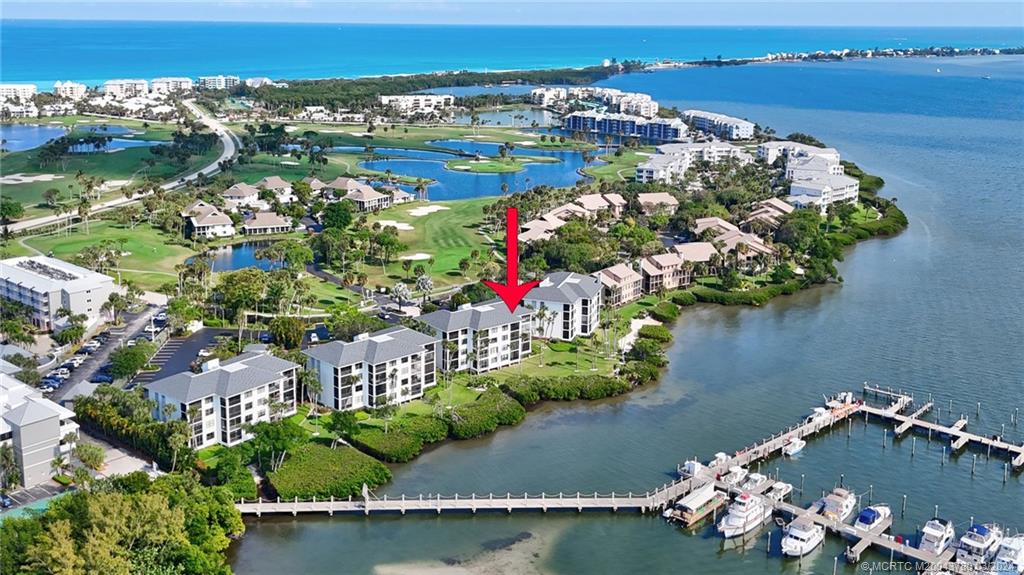 an aerial view of a house with a lake view