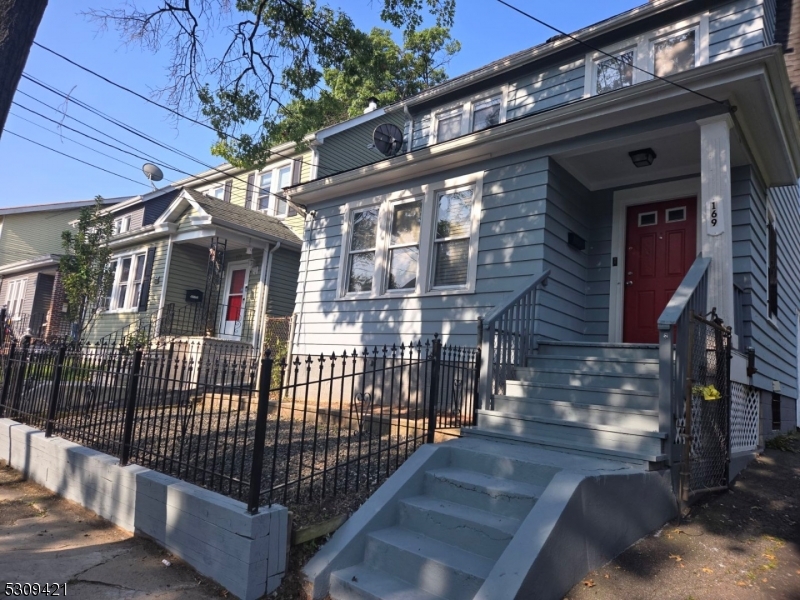 a view of a house with iron stairs