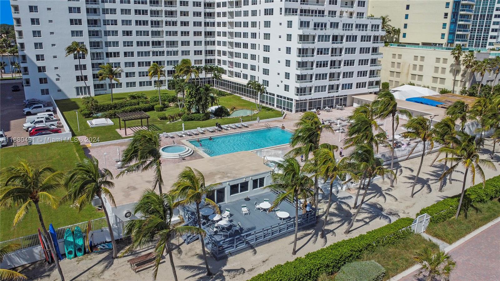 a view of swimming pool outdoor seating and city view